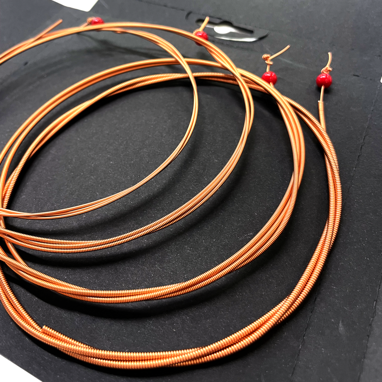 300U Juego de 4 cuerdas Round Spirals para ukelele bajo